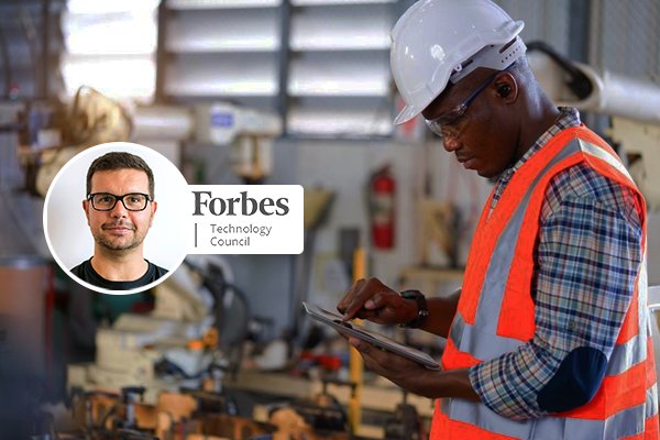 warehouse worker checking handheld screen, Fabio Belloni Forbes tech council logo