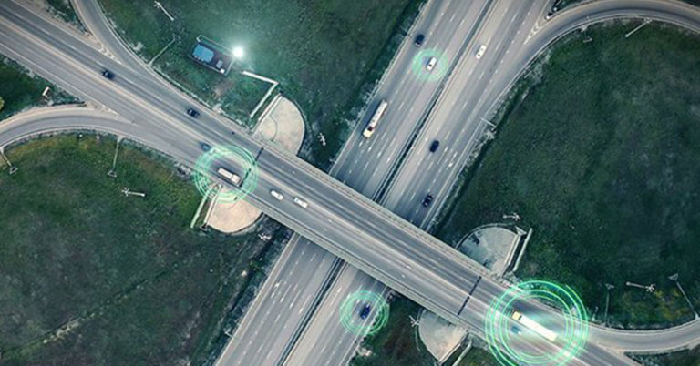 aerial view of highway with cars highlighted by green circles