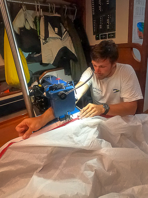 #8 2nd leg Cape Town to Auckland Alex repairing the spinnaker